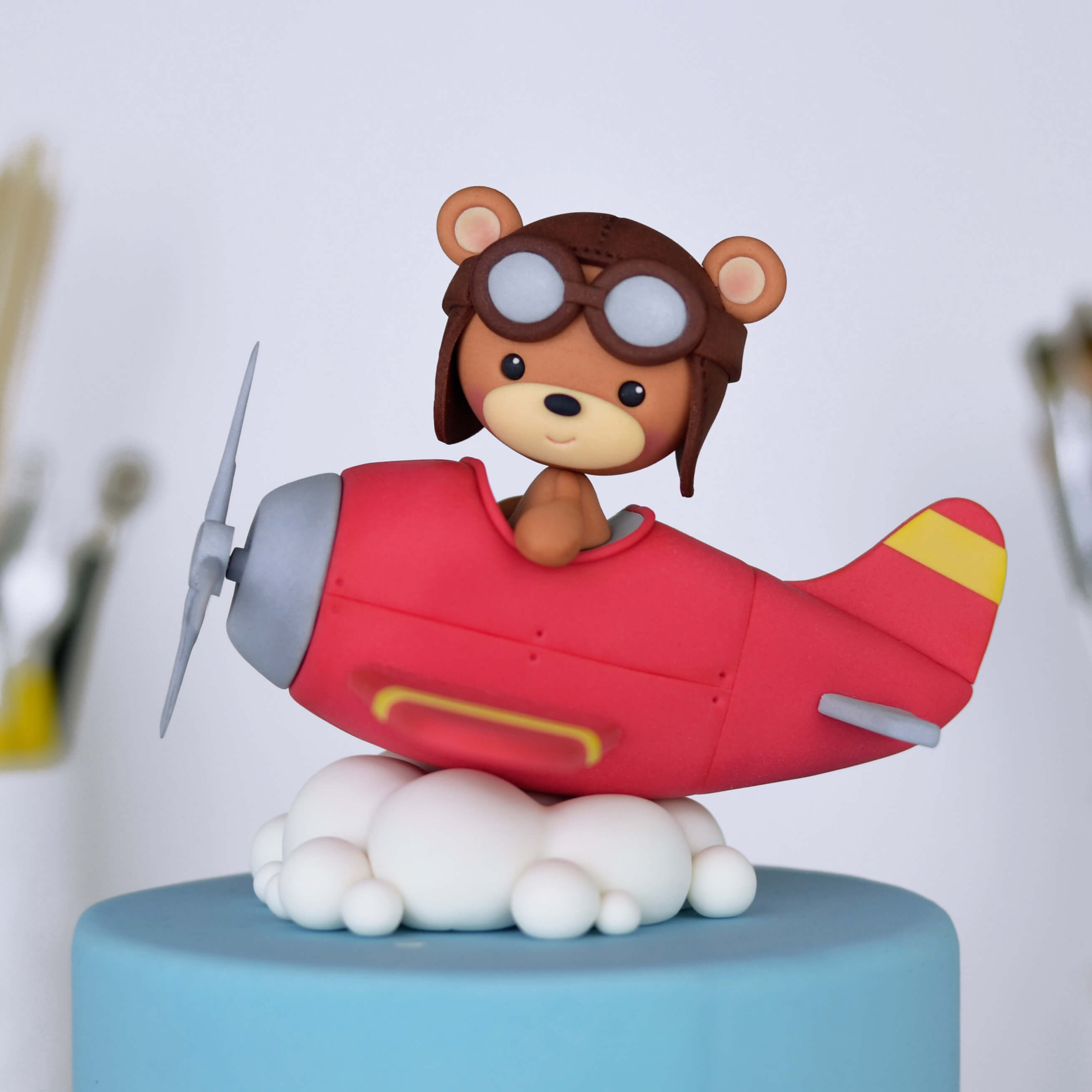 Teddy bear in a plane cake decoration